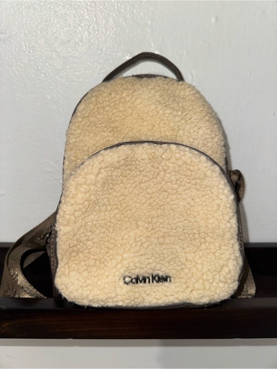Calvin Klein Handbags - Calvin Klein Cream Sherpa Mini Backpack with Brown Trim